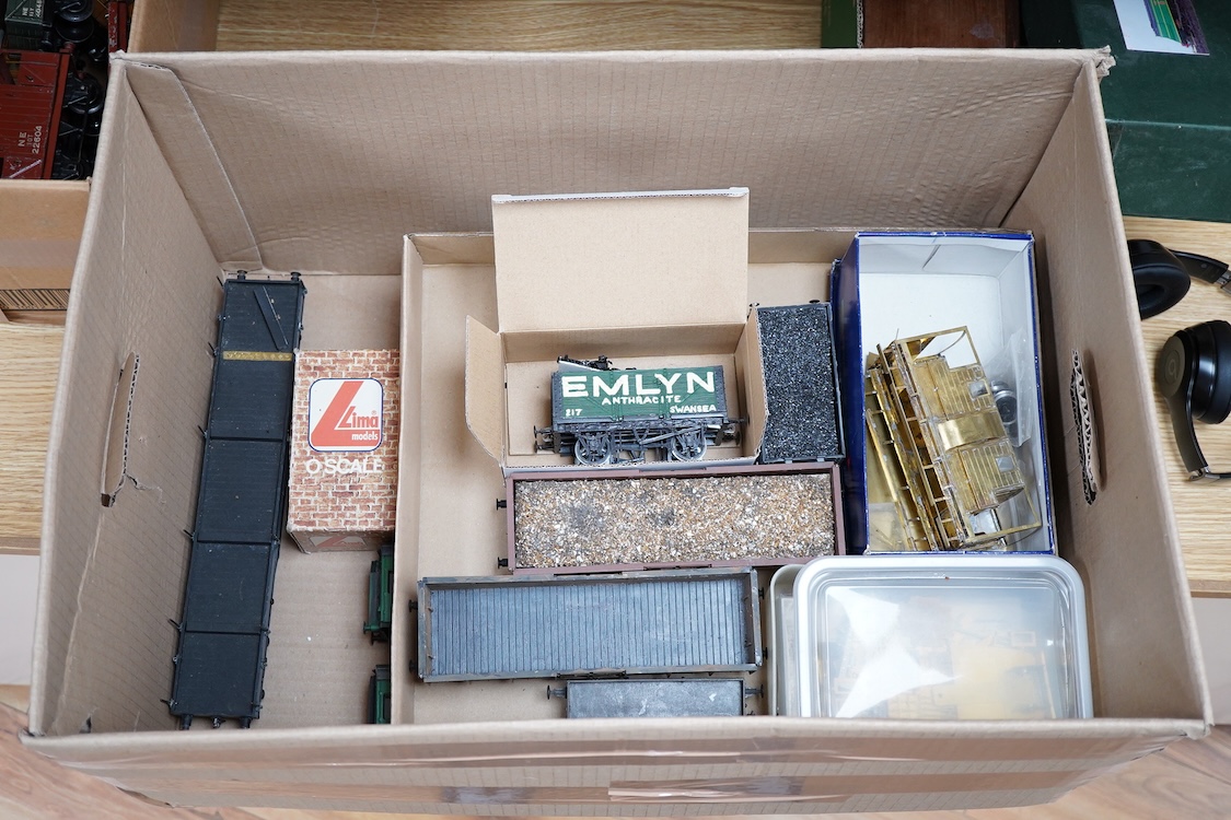 Eleven 0 gauge model railway items including; a bogie stake wagon, two mineral wagons, a North British coal wagon and two further open wagons, a partly constructed brake van, together with a Lima LMS 4F locomotive, two L